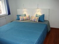 Old string factory - blue apartment 1 - Large double bed with reading lamps